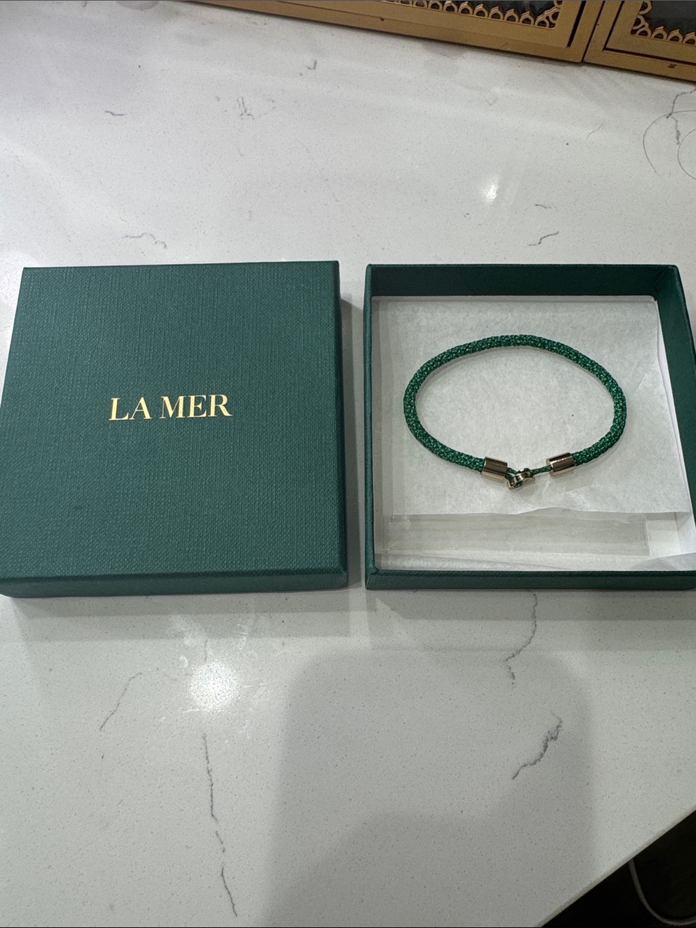 La Mer Green Braided Bracelet with Gold Heart Charm